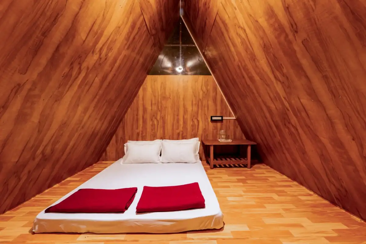 Interior of A-frame cabin at Rain Forest Resort Dandeli