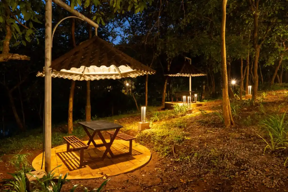 Garden sit-out area for relaxation at Rain Forest Resort Dandeli