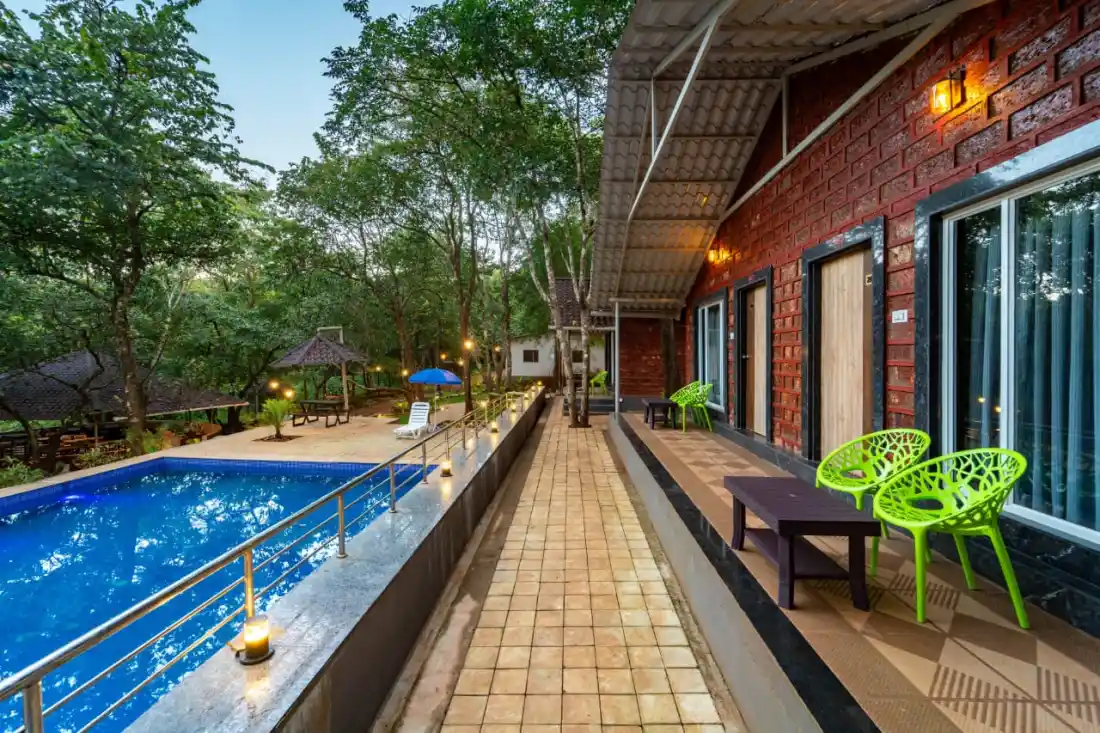 Pool view from cottage balcony at Rain Forest Resort Dandeli